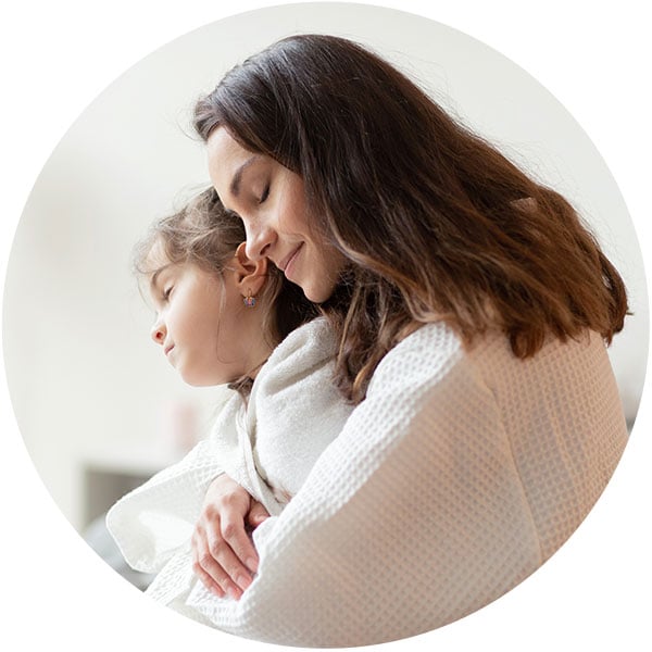 Woman hugging child