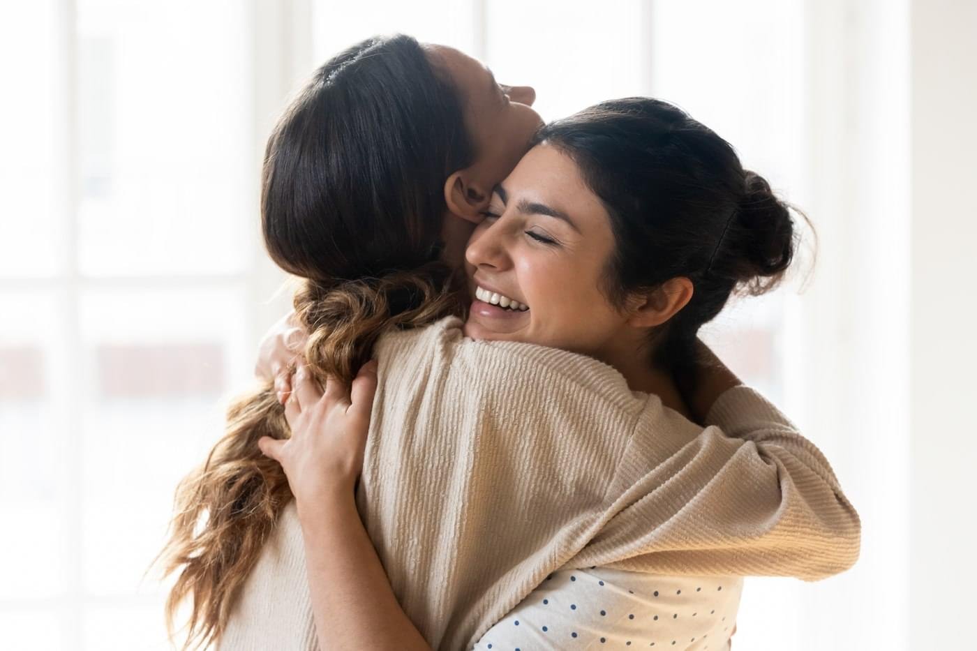 ladies hugging_stock