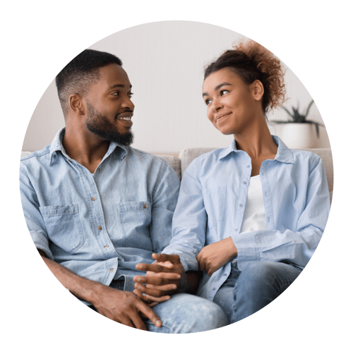 couple smiling in therapists office