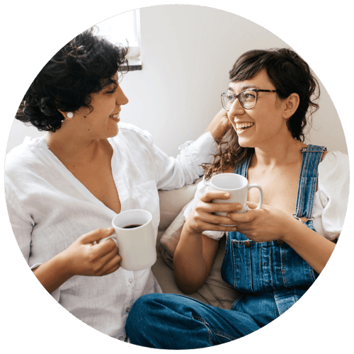 Lesbian couple at home discussing genetic testing