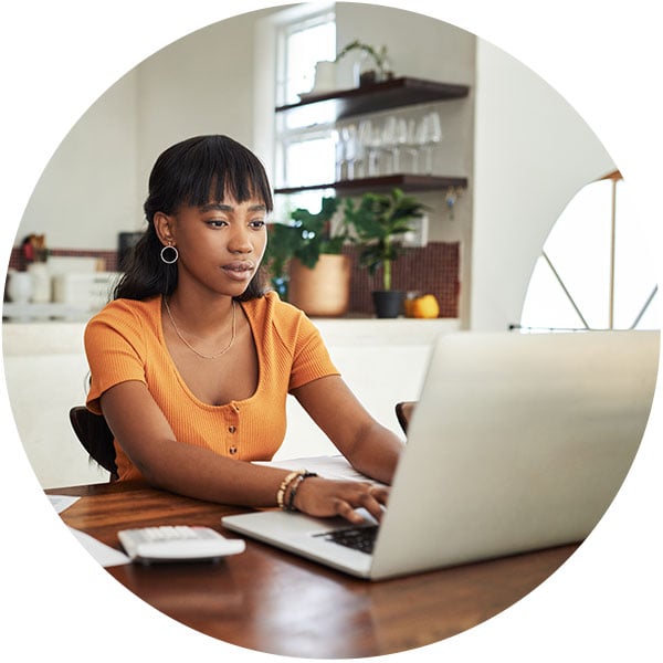 woman sitting at desk with laptop