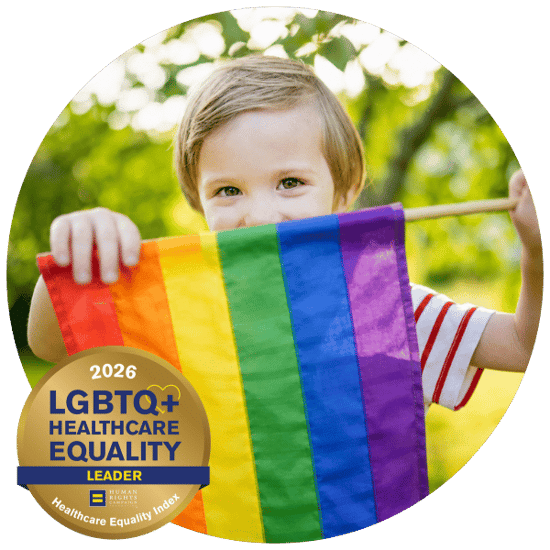 child-holding-pride-flag