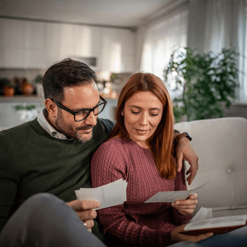 couple looking at family photos_overlap