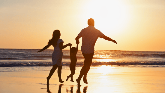 family-at-beach-sunset