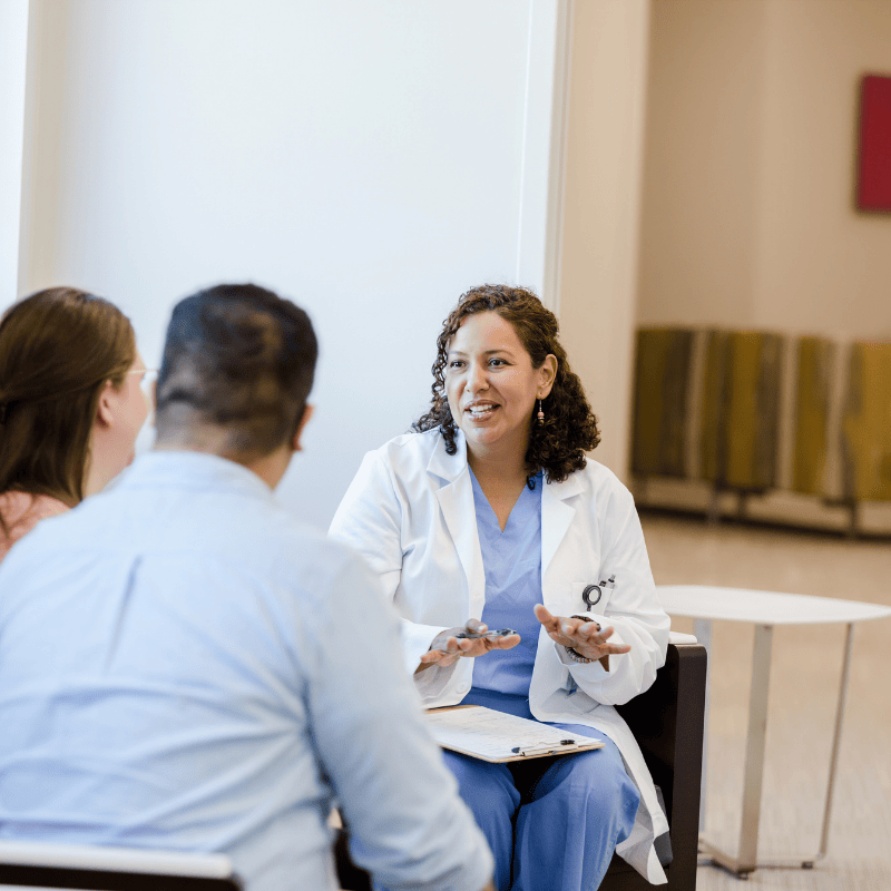 Fertility specialist discussing testing and treatment with patients