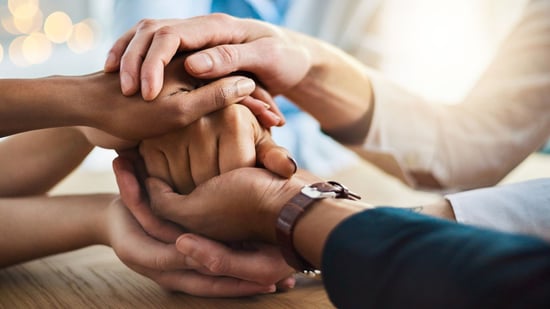 holding hands offering support