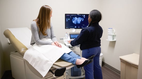 female patient and female nurse fertility testing ultrasound exam room