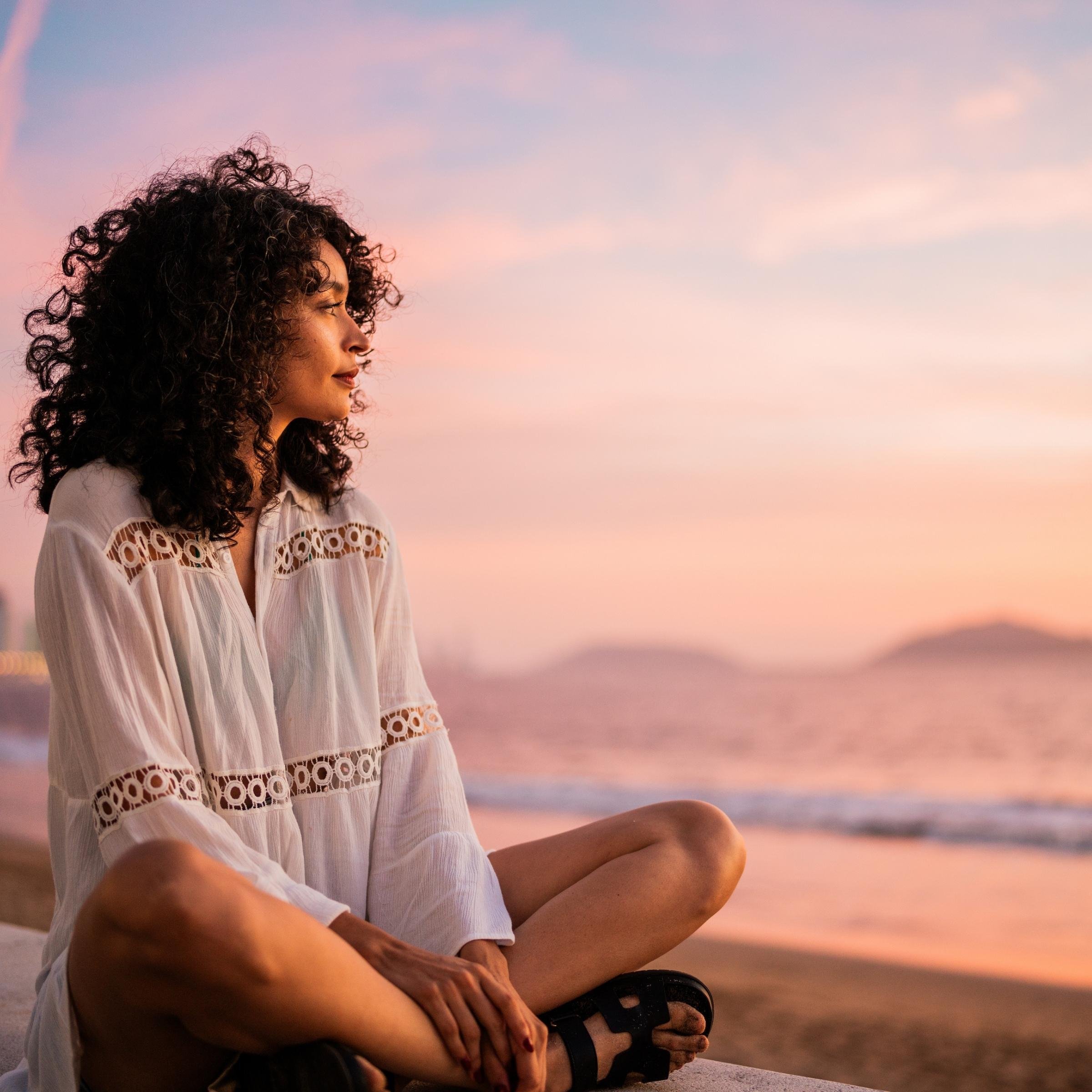 hopeful woman sunset beach