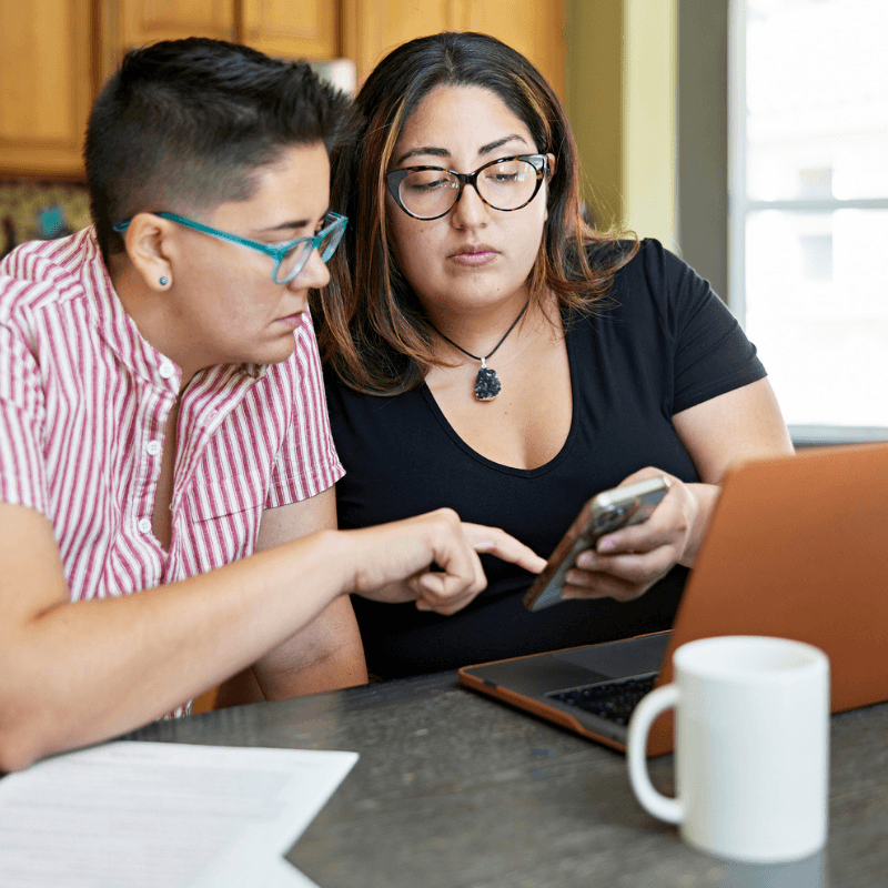 lesbian-couple-looking-at-finances