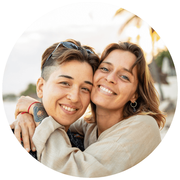 lgbtq-two-moms-couple-embracing-beach