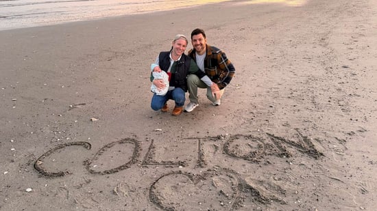 gay dads with infant son at beach