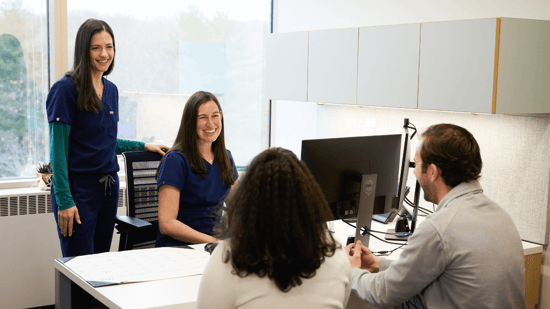 two fertility doctors consulting with infertile couple