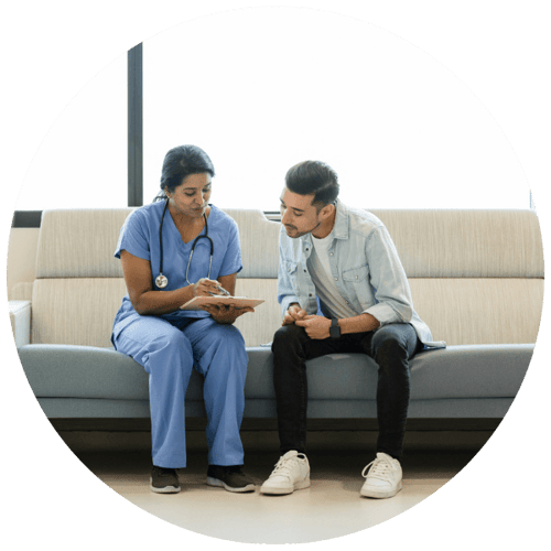 Nurse reviewing test results with a patient.