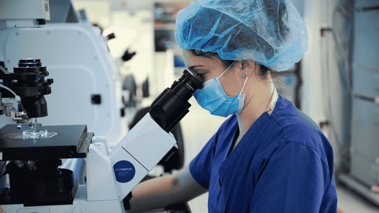 an embryologist performs research in the laboratory at illume fertility clinic
