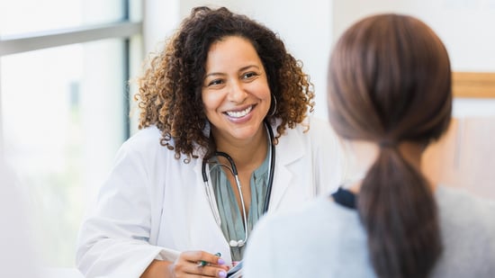 a woman consults with her pcos specialist