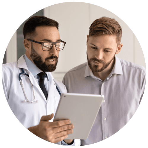 Doctor reviewing information with a patient during a consultation.