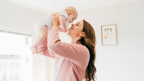 single mom holding baby