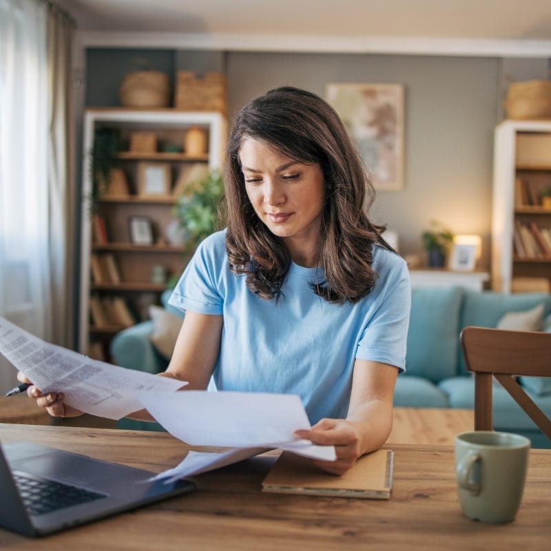 woman-looking-at-bills