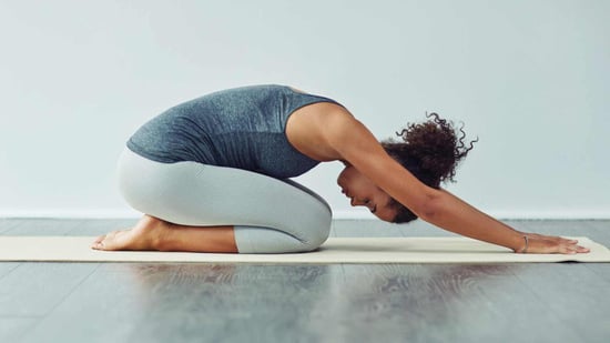 lean pcos young black woman doing yoga pose